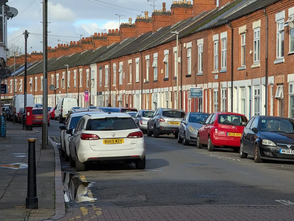 A row of red-brick Victorian terraces in Leicester — on homes like these the radiators, cylinder and back-yard siting shape the budget.