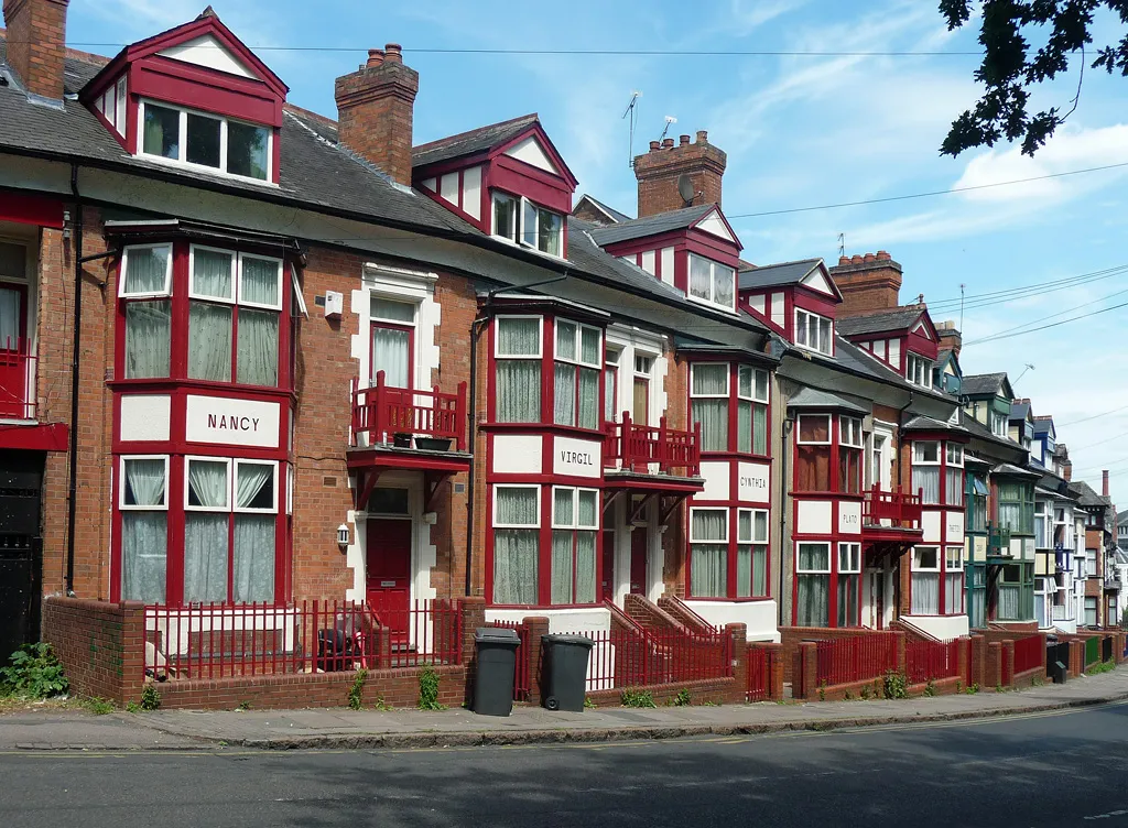 An ornate red-brick Victorian terrace in Leicester — microbore pipes, radiators and cylinder space are the usual hidden costs in homes like this.